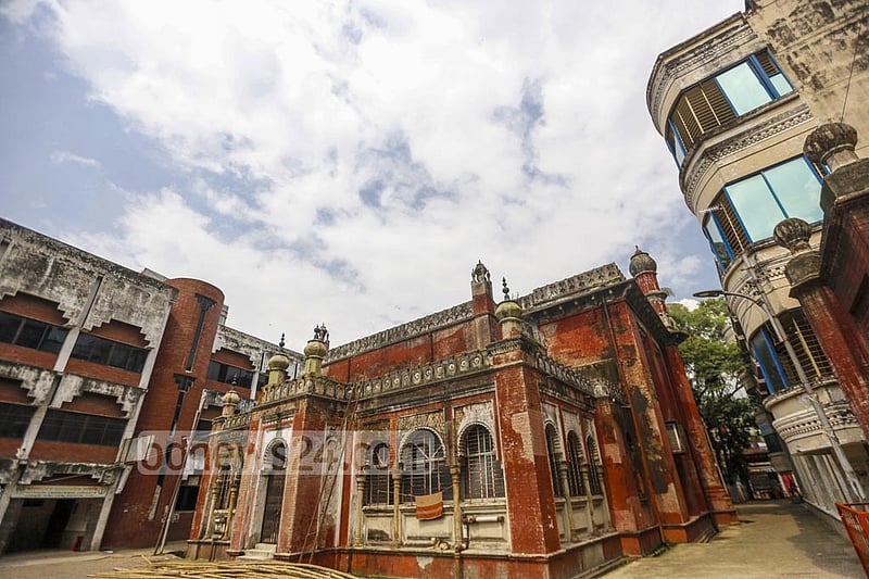 Two high-rise buildings flank each side of the historical Northbrook Hall. Photo: Mahmud Zaman Ovi