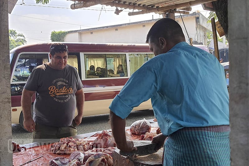 A Russian national working at the nuclear power plant in Pabna is shopping for necessities at a market in Rooppur. Photo: Reazul Bashar