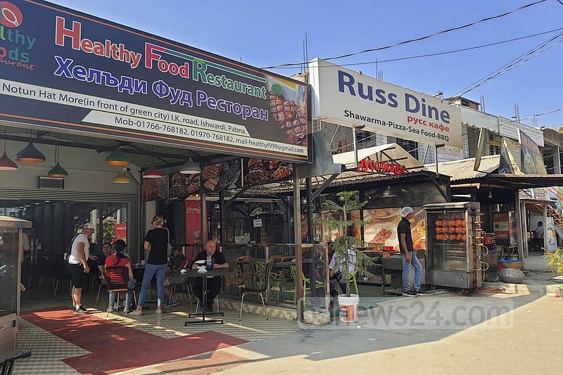 Ishwardi's Rooppur has transformed into a 'mini Russia' over the last few years. From shopping malls to small stalls, all the signboards are now written in Russian alongside Bangla and English. Photo: Reazul Bashar