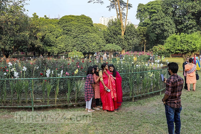 Visitors taking pictures in front of the flower plants at Dhaka’s Ramna Park on Saturday, Feb 05, 2022. Photo: Kazi Salahuddin Razu