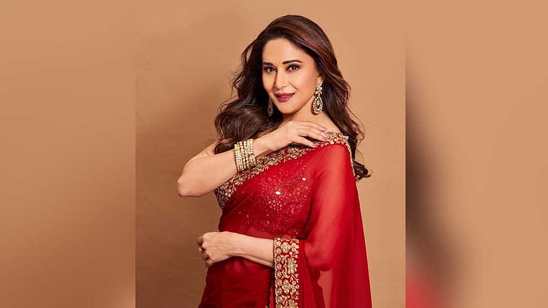 জঙ্গি সংশ্লিষ্টতার দায়ে নিষিদ্ধ ব্যবসায়ীর অনুষ্ঠানে মাধুরী, সমালোচনা