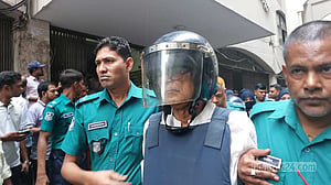 ১০ দিনের রিমান্ড আবেদন শুনে কাঠগড়ায় হাসলেন মেনন