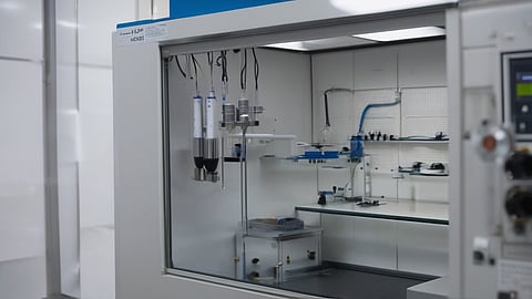 An enclosed battery materials laboratory system with processing vessels and testing equipment, representing Coreshell Technologies’ silicon-anode development under its eight-year LFP cathode materials agreement with L&F.