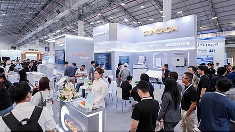 An illustrative exhibition scene depicts hybrid inverters, stackable residential batteries, a C&I battery cabinet and utility-scale storage equipment representing Sungrow’s product display at Solar & Storage Live Vietnam 2026. 