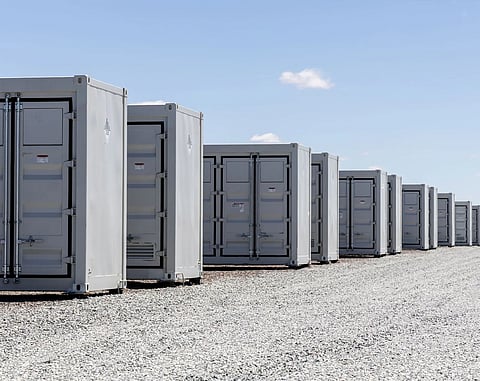 Illustration of utility-scale solar panels and battery energy storage containers representing Avantus' $1.05 billion financing to expand its 24 GW renewable energy pipeline across California and the US Desert Southwest.