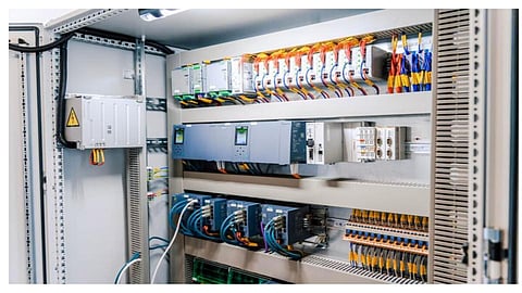 Rooftop solar panels and industrial battery storage units representing Tamil Nadu's clean energy framework.