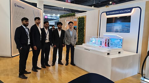 WattPower staff beside the company's EV charging display at its REI Expo 2026 stand.