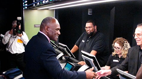 FILE - In this Nov. 20, 2018 file photo, former New York Giants linebacker Harry Carson places a bet on the New York Yankees to win the 2019 World Series at Resorts Casino in Atlantic City, N.J. The race to legalize sports betting is on now that the U.S. Supreme Court has allowed it in all 50 states, but will it provide enough extra tax revenue to make much of a difference for schools, roads or pension debt? (AP Photo/Wayne Parry)