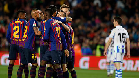 Barcelona defender Jordi Alba, right, celebrates with teammates scoring his side’s 2nd goal during a Spanish La Liga soccer match between FC Barcelona and Real Sociedad at the Camp Nou stadium in Barcelona, Spain, Saturday, April 20, 2019. (AP Photo/Joan Monfort)