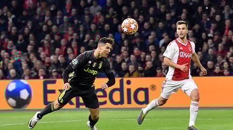 Juventus’ Cristiano Ronaldo scores his side’s opening goal during the Champions League quarterfinal, first leg, soccer match between Ajax and Juventus on April 10, 2019.