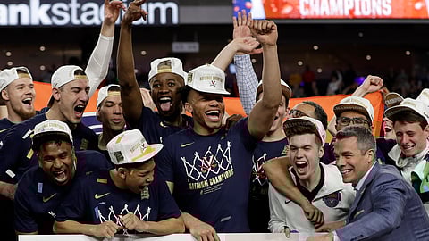 Virginia head coach Tony Bennett celebrates with his team after defeating Texas Tech 85-77 in the overtime in the championship of the Final Four NCAA college basketball tournament on April 8, 2019.