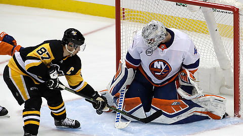 New York Islanders goaltender Robin Lehner stops a shot by Pittsburgh Penguins’ Sidney Crosby during Game 3 of the NHL first-round hockey playoff series on April 14, 2019.