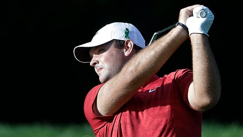 Patrick Reed follows through on the 12th hole of the first round of the Wells Fargo Championship on May 2 (Chuck Burton)