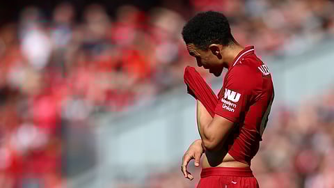 Liverpool’s Trent Alexander-Arnold reacts during the English Premier League soccer match between Liverpool and Wolverhampton Wanderers at the Anfield stadium in Liverpool, England, Sunday, May 12, 2019. (AP Photo/Dave Thompson)