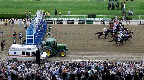 FILE - In this Saturday, June 9, 2018, file photo, race horses break out of the starting gate during the 150th running of the Belmont Stakes horse race, in Elmont, N.Y. Justify won to win the Triple Crown. The home of the Belmont is laps ahead of other racetracks around the country when it comes to safety measures to keep horses and jockeys safe. (AP Photo/Mel Evans, File)