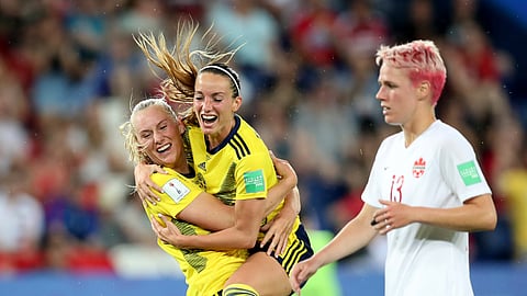 Sweden’s Stina Blackstenius, left, celebrates after scoring the opening goal during the Women’s World Cup round of 16 soccer match between Canada and Sweden at Parc des Princes in Paris, France, Monday, June 24, 2019. (AP Photo/Francisco Seco)
