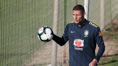 Richarlison holds a ball during a training session of Brazil national soccer team in Porto Alegre, Brazil, Wednesday, June 26, 2019. Brazil will play against Paraguay for a Copa America quarter-final match on June 27.(AP Photo/Natacha Pisarenko)