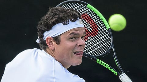 Milos Raonic returns the ball to Jo-Wilfried Tsonga on June 12  (Silas Stein/dpa)