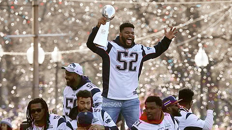 In this Feb. 5, 2019, file photo, New England Patriots' Elandon Roberts rides a duck boat during the Patriots parade through downtown Boston to celebrate their win over the Los Angeles Rams in NFL Super Bowl 53.