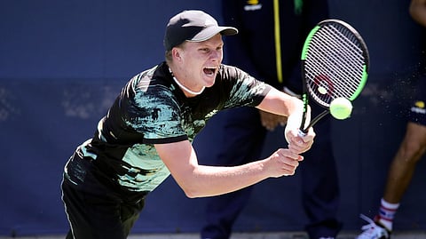 Jenson Brooksby, of the United States, returns a shot to Tomas Berdych, of the Czech Republic, during the first round of the US Open tennis tournament Monday, Aug. 26, 2019, in New York. (AP Photo/Michael Owens)