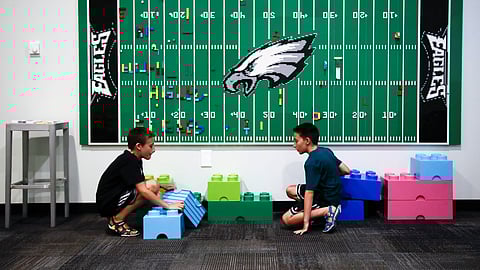 In this Thursday, Aug. 22, 2019, photo, 10-year-old twin brothers Ryan left, and Jack Ykoruk, play in the Lincoln Financial Field sensory room before a preseason NFL football game between the Philadelphia Eagles and the Baltimore Ravens in Philadelphia. (AP Photo/Matt Rourke)