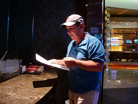 n this Sept. 4, 2019 photo, Andy Lanni of Oceanview, N.J. checks the odds at the sports book in the Borgata casino in Atlantic City, N.J. As the second NFL season begins following a U.S. Supreme Court decision clearing the way for legal sports betting, the industry is growing larger and ever-more mobile in the U.S. (AP Photo/Wayne Parry)