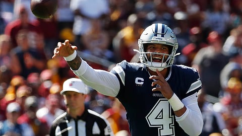Dallas Cowboys quarterback Dak Prescott (4) passes downfield during the second half of an NFL football game, Sunday, Sept. 15, 2019, in Landover, Md.