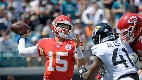 FILE - In this Sept. 8, 2019, file photo, Kansas City Chiefs quarterback Patrick Mahomes (15) throws a pass as he is pressured by Jacksonville Jaguars defensive end Josh Allen during the first half of an NFL football game in Jacksonville, Fla. Mahomes Mahomes is the reigning league MVP. (AP Photo/Phelan M. Ebenhack, File)