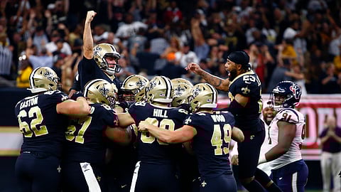 New Orleans Saints kicker Wil Lutz celebrates his game winning 58-yard field goal at the end of regulation in the second half of an NFL football game against the Houston Texans in New Orleans, Monday, Sept. 9, 2019. The Saints won 30-28. (AP Photo/Butch Dill)