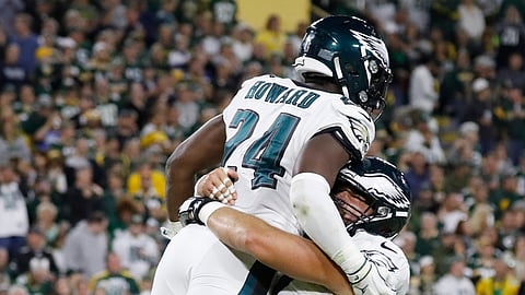 Philadelphia Eagles running back Jordan Howard (24) and center Jason Kelce (62) celebrate a touchdown during the first half of the team's NFL football game against the Green Bay Packers on Thursday, Sept. 26, 2019, in Green Bay, Wis. (AP Photo/Jeffrey Phelps)
