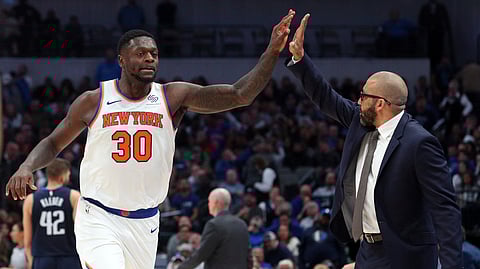 New York Knicks forward Julius Randle (30) high-fives New York Knicks head coach David Fizdale near the end of an NBA basketball game against the Dallas Mavericks, Friday, Nov. 8, 2019, in Dallas. (AP Photo/Richard W. Rodriguez)