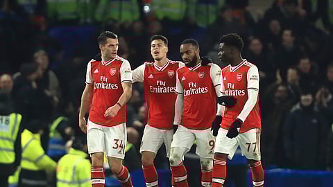 Arsenal's players celebrate a goal against Chelsea during the English Premier League soccer match between Chelsea and Arsenal at Stamford Bridge stadium in London England, Tuesday, Jan. 21, 2020. 