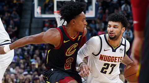 Nuggets guard Jamal Murray (right) drives past Cavaliers guard Collin Sexton on Jan. 11