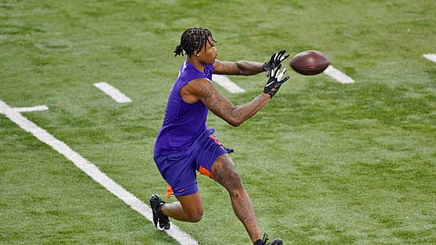 Clemson football player Tee Higgins catches a pass while running drills during NFL Pro Day Thursday, March 12, 2020, in Clemson, S.C. Will he be a first-round NFL Draft pick? Mark Eckel thinks so.