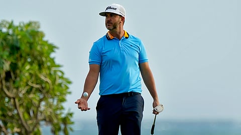 Scott Piercy tosses his ball after missing his birdie putt on the 16th green during the first round of the Sony Open PGA Tour golf event, Thursday, Jan. 9, 2020, at Waialae Country Club in Honolulu. (AP Photo/Matt York)