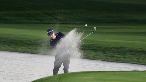 Patrick Cantlay hits onto the 11th green, during the first round of The Players Championship golf tournament Thursday, March 12, 2020, in Ponte Vedra Beach, Florida.