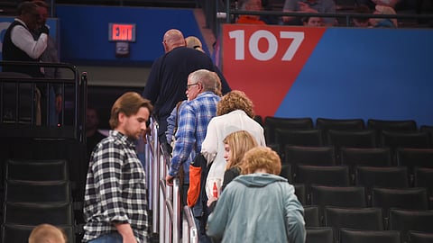 Basketball fans leave Chesapeake Energy Arena after it is announced that an NBA basketball game between Oklahoma City Thunder and Utah Jazz in Oklahoma City has been postponed, Wednesday, March 11, 2020.