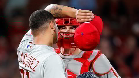 In this May 6, 2019, file photo, Philadelphia Phillies starting pitcher Vince Velasquez, left, talks on the mound with catcher J.T. Realmuto during the fourth inning of a baseball game against the St. Louis Cardinals in St. Louis. 
