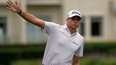In this photo taken Thursday, June 18, 2020 Nick Watney signals after a tee shot during the first round of the RBC Heritage Golf tournament at Harbour Town Golf Links in Hilton Head, S.C. Watney has tested positive for coronavirus and did not play in Friday's round. (AP Photo/Gerry Broome)