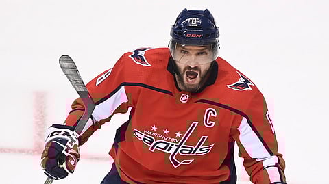 Washington Capitals left wing Alex Ovechkin celebrates his goal against the New York Islanders during the second period of an NHL Eastern Conference Stanley Cup hockey playoff game in Toronto, Friday, Aug. 14, 2020. 