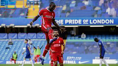 Liverpool's Sadio Mane celebrates after scoring during the English Premier League soccer match between Chelsea and Liverpool at Stamford Bridge Stadium, Sunday, Sept. 20, 2020. 