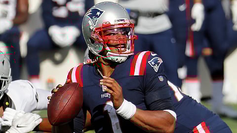 New England Patriots quarterback Cam Newton looks to pass against the Las Vegas Raiders during an NFL game at Gillette Stadium, Sunday, Sept. 27, 2020 in Foxborough, Mass. Maybe the third time will actually bring a kickoff between for the Denver Broncos and New England Patriots. 