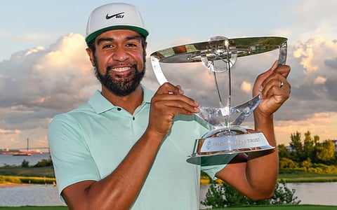 Tony Finau with the Northern Trust trophy, Can he win back-to-back? Mike Kern doesn't think so.