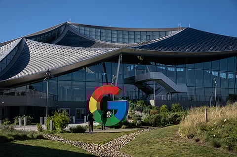 Visitors take a photograph in front of the Google Bay View campus in Mountain View, California. 
