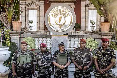 Colonel Michael Randrianirina, center, in front of the presidential palace, in Antananarivo, Madagascar, on Oct. 14. 