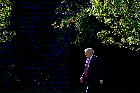 US President Donald Trump walks on the South Lawn of the White House