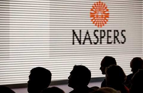 A Naspers Ltd. logo is displayed on a large electronic screen