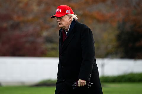 US President Donald Trump walks on the South Lawn of the White House after arriving on Marine One in Washington, DC, US, on Saturday, Nov. 22, 2025. US officials are having early discussions on whether to let Nvidia Corp. sell its H200 artificial intelligence chips to China, according to people familiar with the matter, a contentious potential move that would mark a major win for the world's most valuable company.