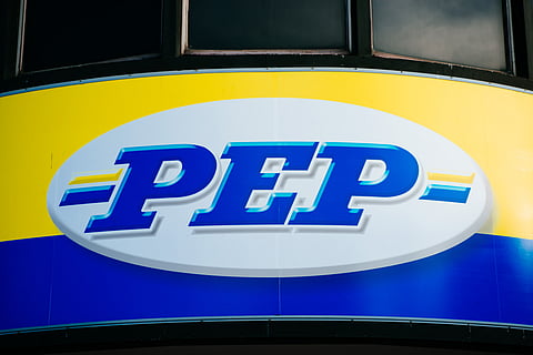 A Pepkor Holdings Pty Ltd. (PEP) logo sits on display outside the company's offices in Parow Industrial near Cape Town, South Africa, on Wednesday, Aug. 17, 2016. Acquisitions including Pepkor Holdings Pty Ltd. and French furniture chain Conforama France SA have transformed Steinhoff International Holdings NV, which employs 90,000 people and has more than 6,500 stores in 30 countries from the U.K. to Australia. Photographer: Waldo Swiegers/Bloomberg