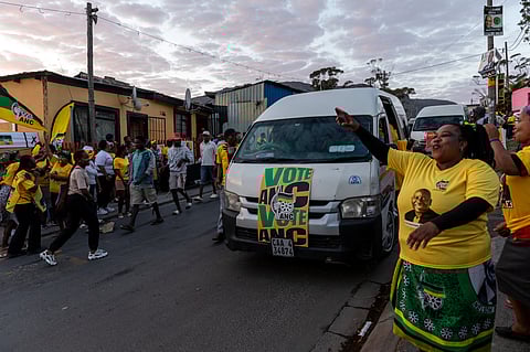 Supporters of the African National Congress (ANC) outside the Iziko Lobomi community centre polling station in Imizamo Yethu, in the Hout Bay district of Cape Town, South Africa, on Wednesday, May 29, 2024. South Africans vote in an election that looks set to reshape a political landscape dominated for three decades by the party that Nelson Mandela led to power. Photographer: Dwayne Senior/Bloomberg